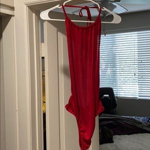 Red open back onesie